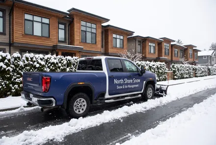 North Shore Snow truck clearing a townhouse strata driveway
