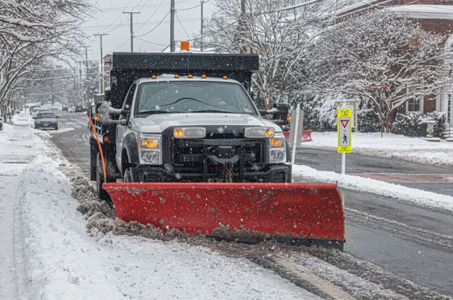 De-icing treatment being applied to a walkway